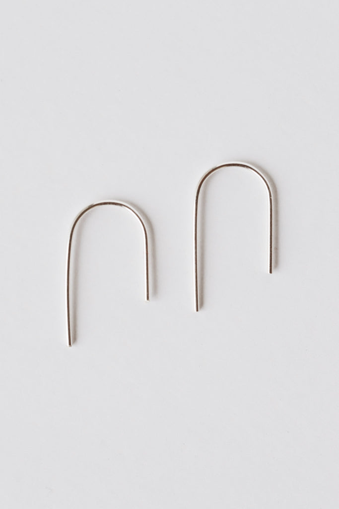 WIRE BENT UNEVEN ARCH EARRINGS · STERLING SILVER